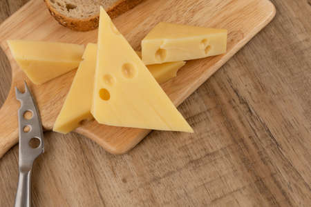 emmental cheese, wood backgroundの写真素材