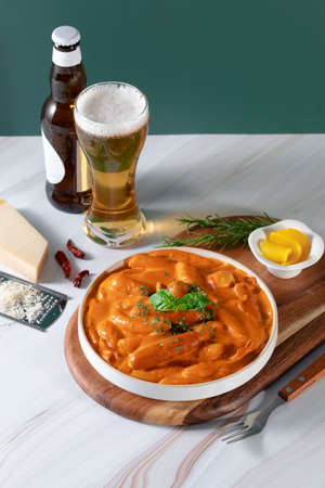 cheese rose Tteokbokki, famous Korean simmered rice cake dish with beer