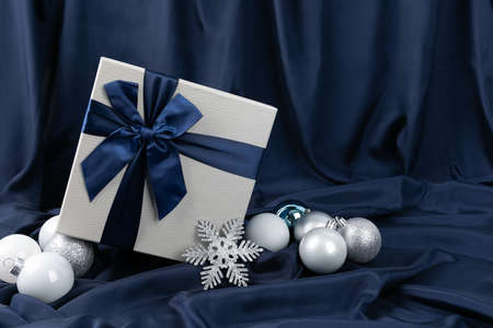 Christmas concept with gift box and ornament in navy backgroundの写真素材