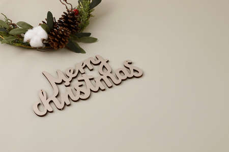 beige background with Christmas ornaments and pine coneの写真素材