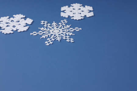 blue background with Christmas and snow ornamentsの写真素材