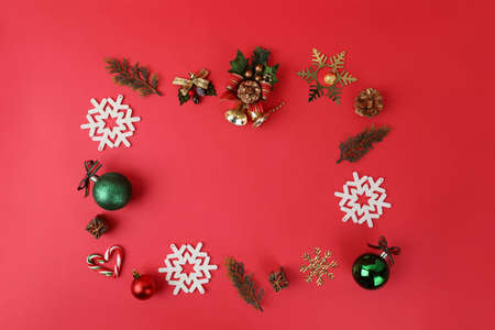 Christmas ornaments in square frame, red background