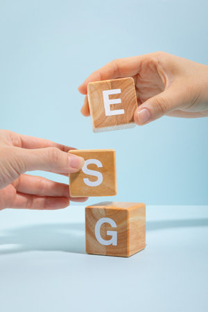 protect earth and environment concept, esg wooden box and hand