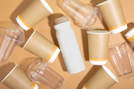 protect earth and environment concept, tumbler and paper, plastic cups