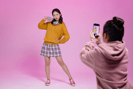 mz generation Asian Korean female hipster influencer, creator concept : creating short form video contentの写真素材