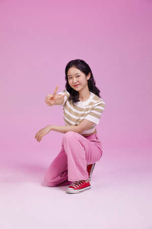 mz generation Asian Korean girl in confident pose