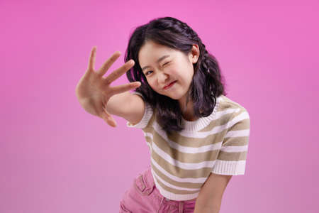 mz generation, happy Asian Korean girl welcomingの写真素材