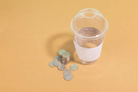 protect earth and environment concept, plastic cup and coin, return for cashの写真素材