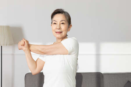 Asian Korean senior woman, home training fitnessの写真素材
