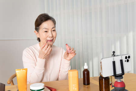 Asian Korean senior woman beauty creator, influencer, vlogger conceptの写真素材