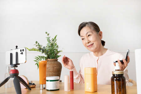 Asian Korean senior woman beauty creator, influencer, vlogger concept
