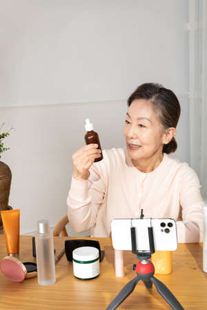 Asian Korean senior woman beauty creator, influencer, vlogger conceptの写真素材