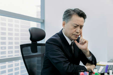 business concept asian korean man, making a long face