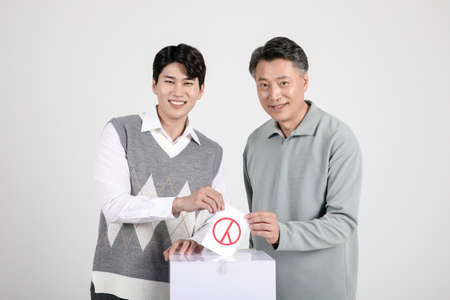 asian korean old and young two men votingの写真素材