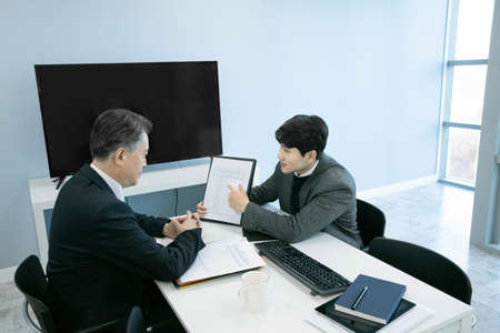business concept asian korean old and young two men, different generations male man boss and employee concept, meetingの写真素材