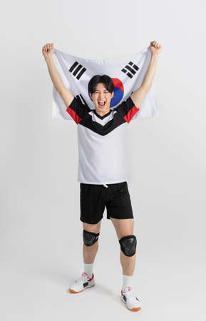 volleyball sports player, asian korean man holding Korean flag Taegeukgiの写真素材