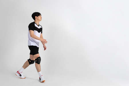 volleyball sports player, asian korean man preparing serve, serving the ball