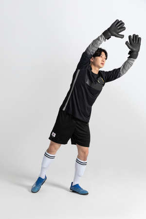 soccer football sports player, asian korean man with motions in studio background