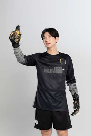 soccer football sports player, asian korean man with motions in studio background