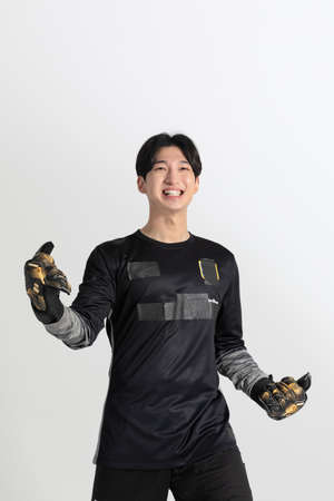 soccer football sports player, asian korean man with motions in studio backgroundの写真素材