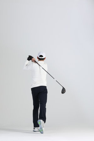 golf sports player, asian korean man with golf club in studioの写真素材
