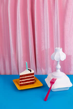a piece of red velvet cake, pink background