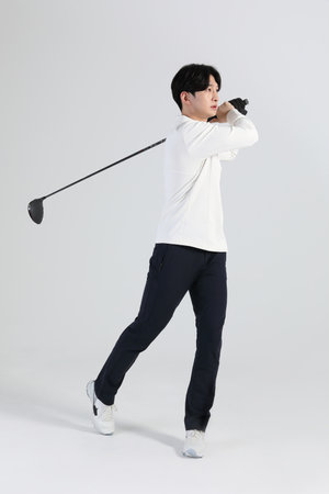 golf sports player, asian korean man with golf club in studioの写真素材