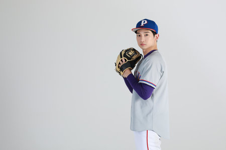 baseball sports player, asian korean man with motionsの写真素材
