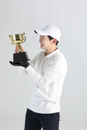golf sports player, asian korean man with trophyの写真素材