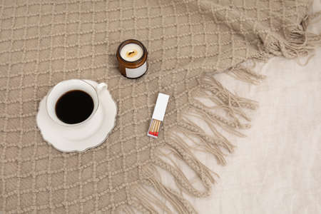 relax cozy objects and background with coffee, candle, bedding, matchの写真素材