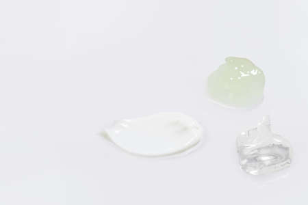 isolated smear beauty cosmetics texture of face cream, white backgroundの写真素材