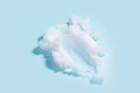 isolated smear beauty cosmetics texture of cleansing balm in blue background