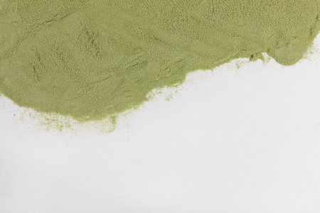 pile of matcha green tea powder, white backgroundの写真素材