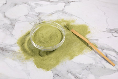 matcha green tea powder powder in a white bowlの写真素材