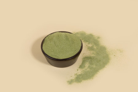 Matcha green tea powder in bowlの写真素材