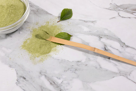 matcha green tea powder powder in a white bowl