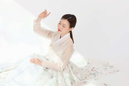 Asian Korean young woman wearing Hanbok Korean traditional clothes, beauty concept in studioの写真素材