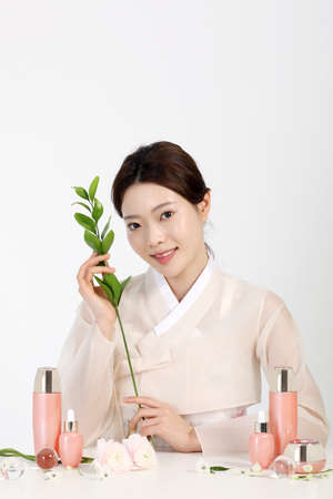 Asian Korean young woman wearing Hanbok Korean traditional clothes, cosmetics makeup beauty concept in studioの写真素材