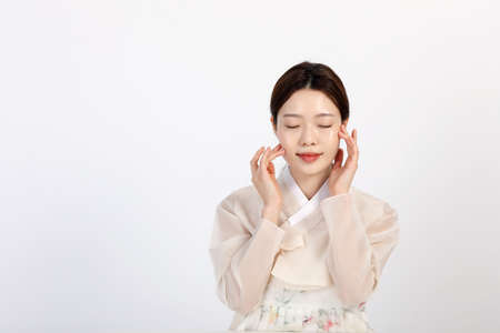 Asian Korean young woman wearing Hanbok Korean traditional clothes, beauty concept in studioの写真素材