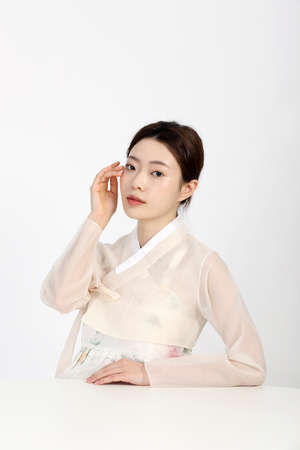 Asian Korean young woman wearing Hanbok Korean traditional clothes, beauty concept in studioの写真素材