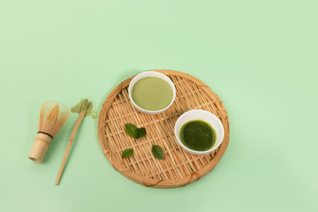 matcha green tea powder and drink in green backgroundの写真素材