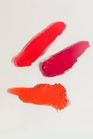 isolated smear beauty cosmetics texture of lipstick, lip tint, white backgroundの写真素材