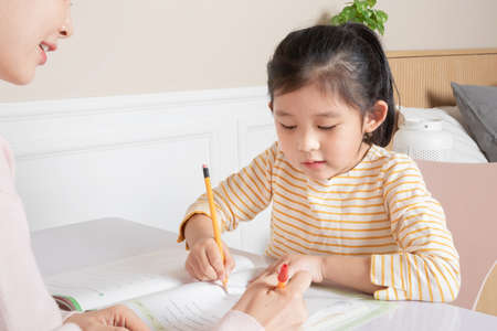 Asian Korean mother and daughter study together