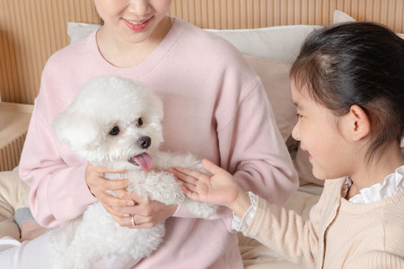 Asian Korean mother and daughter communicating with dogs