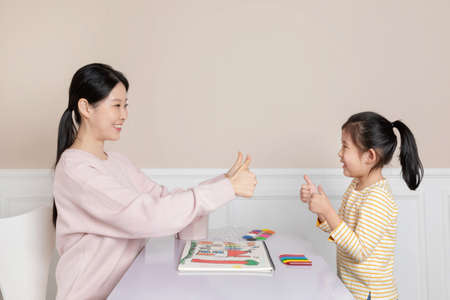 Asian Korean mom compliments the finished drawingの写真素材