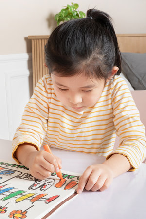 Asian Korean mother and daughter drawing togetherの写真素材