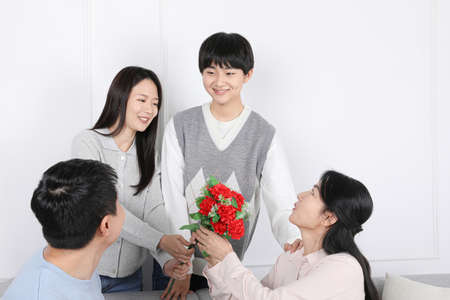 Asian Korean Family_Picture of carnations for parentsの写真素材