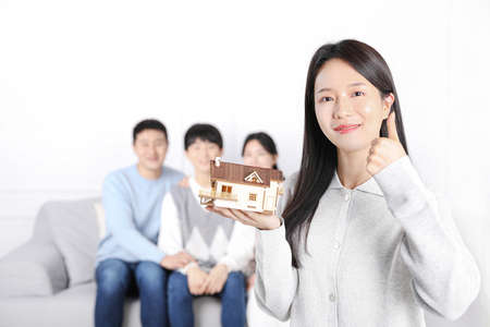 Asian Korean family_photo holding model houseの写真素材