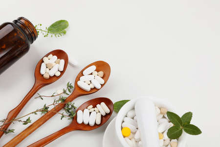 medicine bottle, spoon, medicine bowl, white background, medical creative concept photoの写真素材