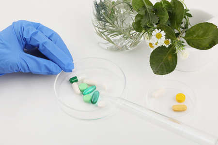 hand motion for study of drugs, white background, medical creative concept photo